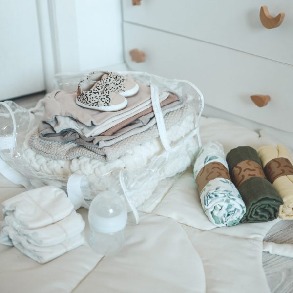 Bag with things to the maternity hospital, the concept of motherhood and expectation of a baby.