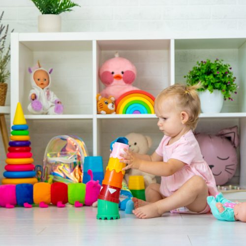 little girl is playing with toys. Selective focus.